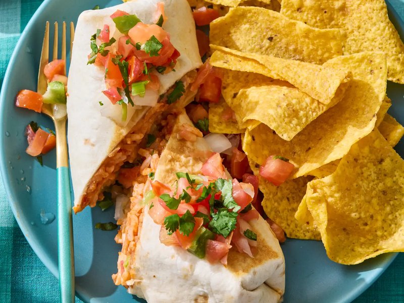 Burrito with toppings and tortilla chips