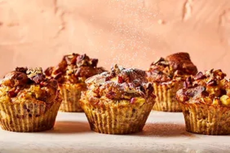 Air fryer apple bacon French toast cups on a wooden surface