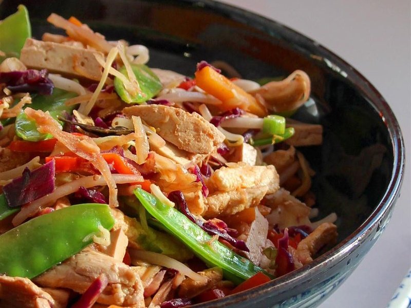 close up view of Skillet Slaw with vegetables and noodles in a bowl