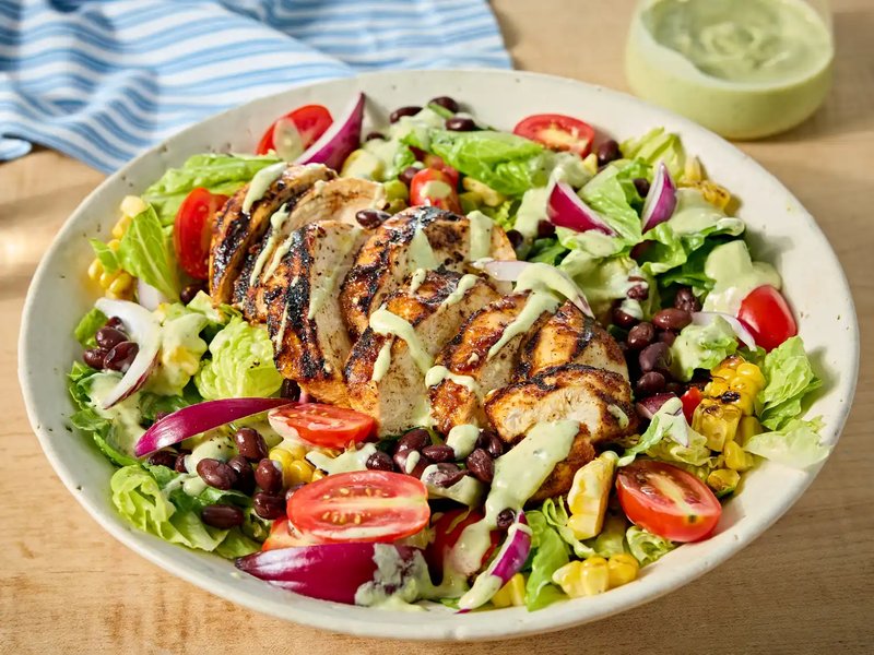 Southwest chicken salad with greens grilled chicken and assorted toppings