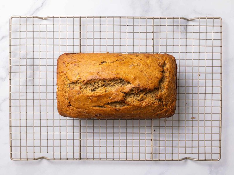 Loaf of banana bread on a cooling rack